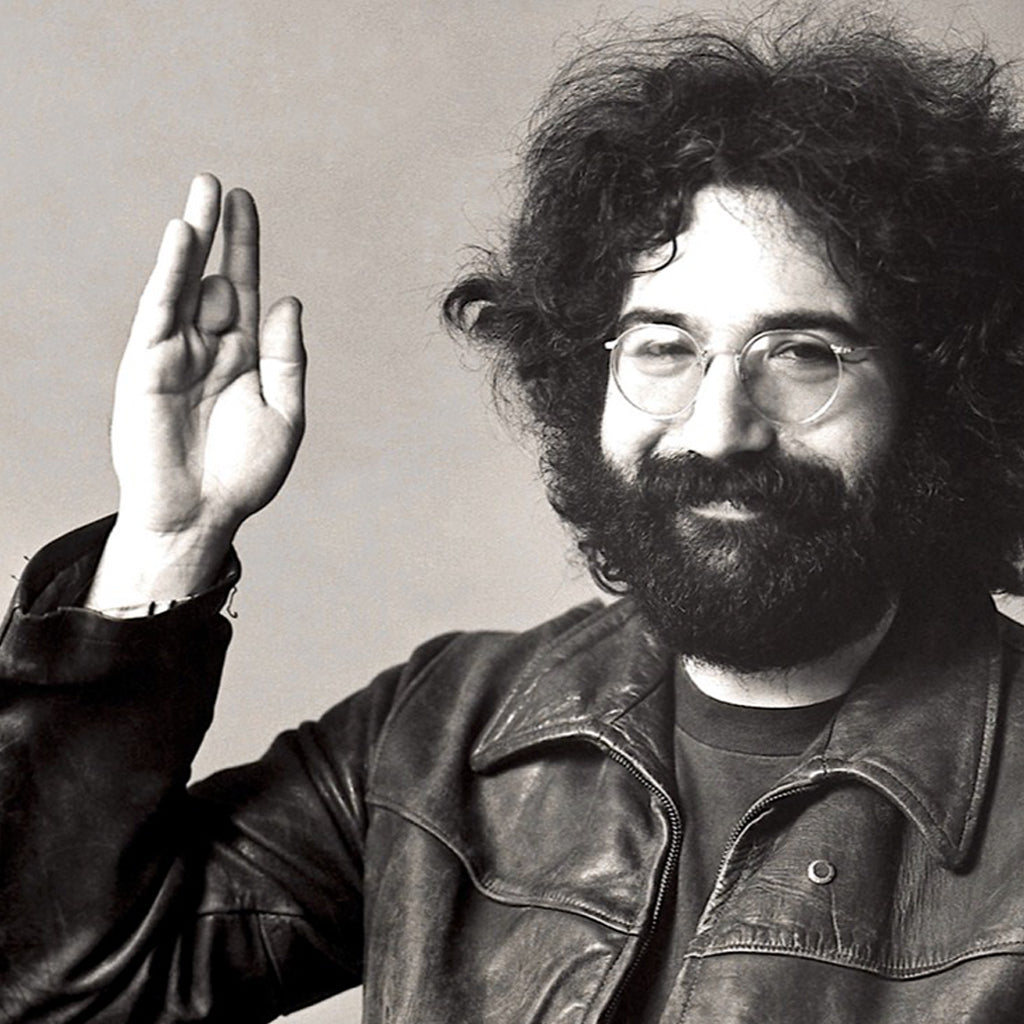 Jerry Garcia black and white holding up right hand palm side out. 