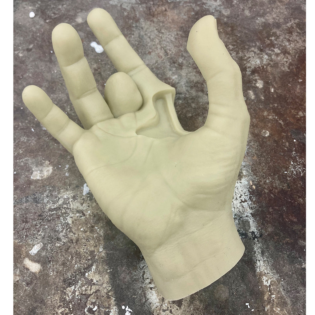 Right hand of Jerry Garcia in tan color laying palm side up. 