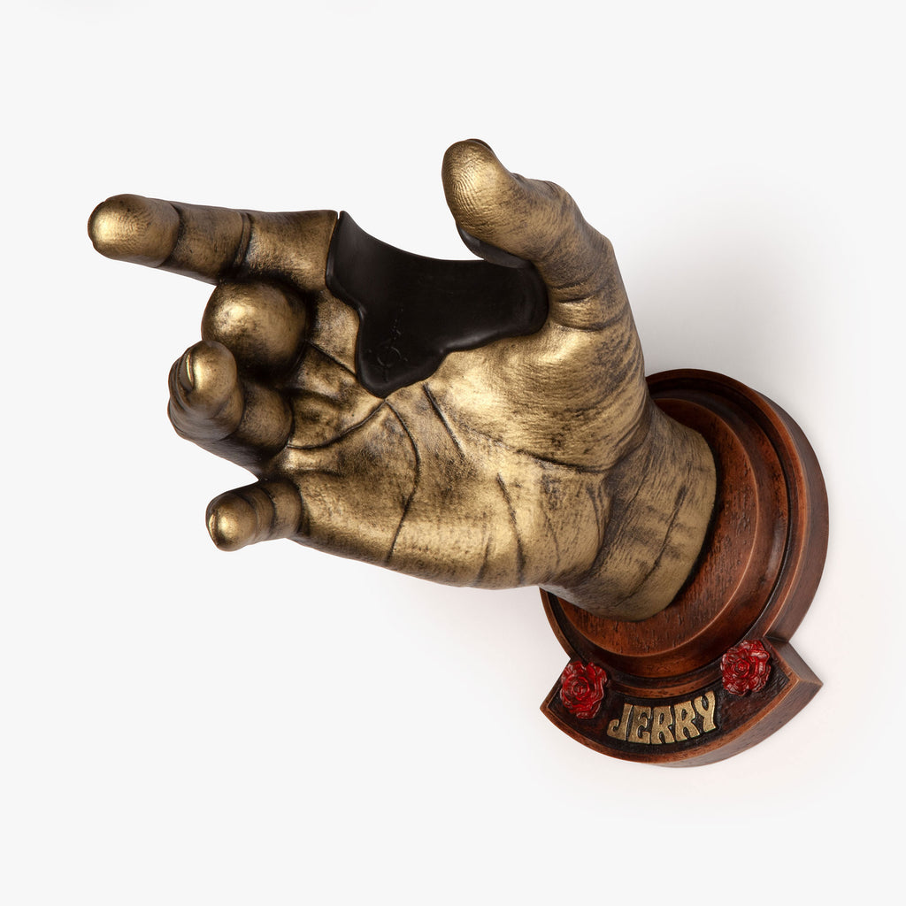 Jerry Garcia sculpted hand guitar wall mount. In gold finish with faux wood backplate. 