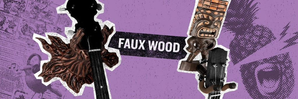 Tree branch and tiki man guitar and ukulele wall hangers on purple background.