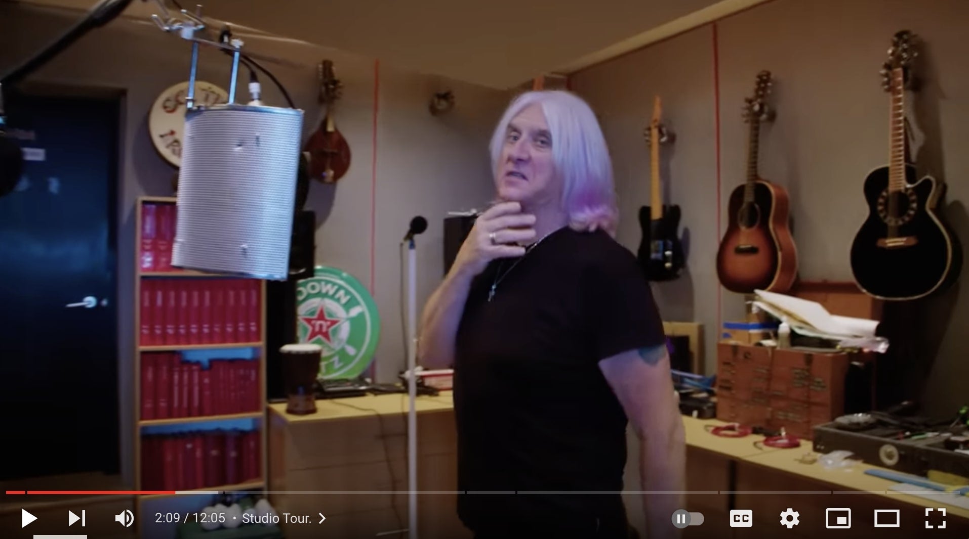 Def Leppard Joe Elliott in studio with guitars and hand guitar hangers from GuitarGrip.