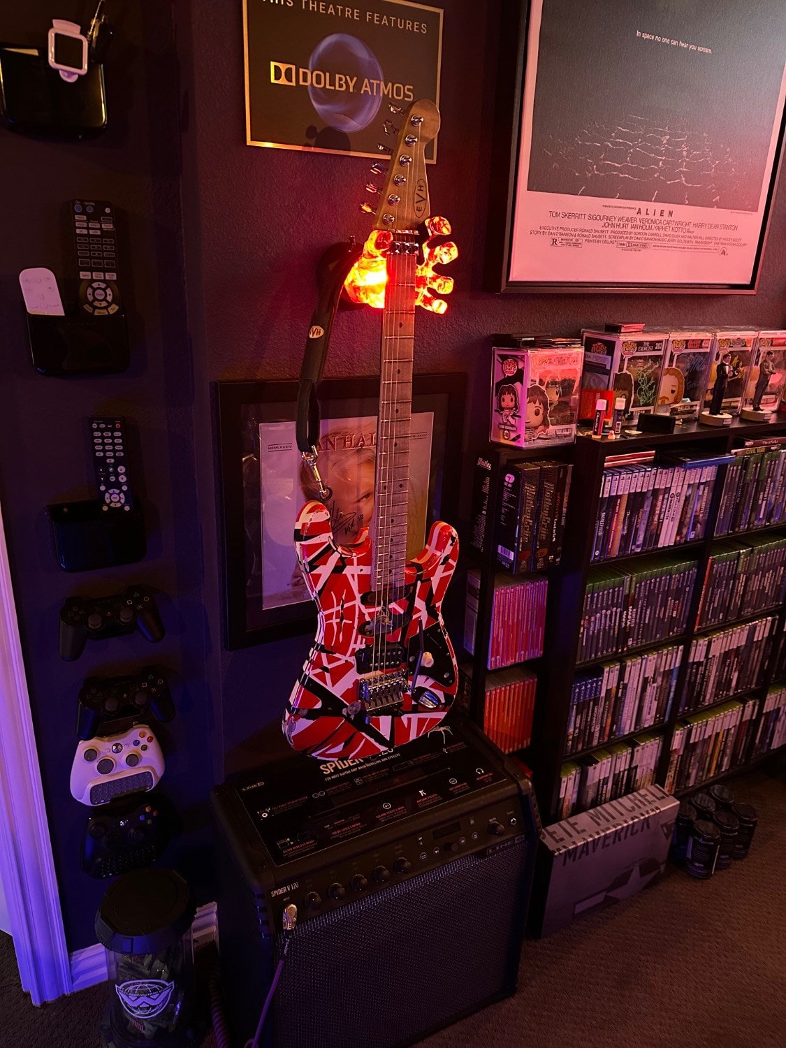 LED guitar hanger wall mount that lights up with different colors.