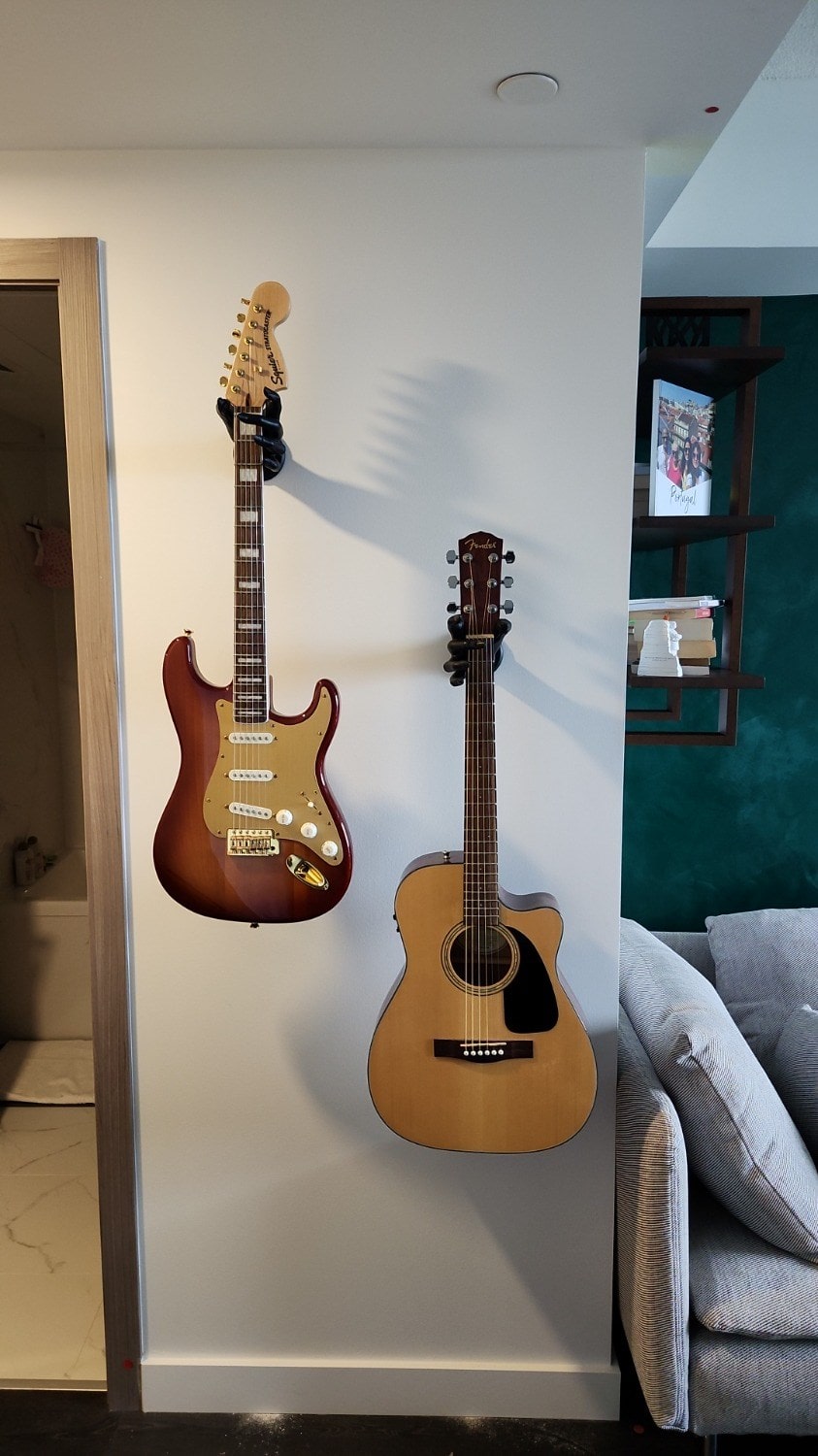 Wall hangers for displaying guitars and other instrument storage. 