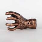 Outside view of GuitarGrip male hand copper guitar hanger.