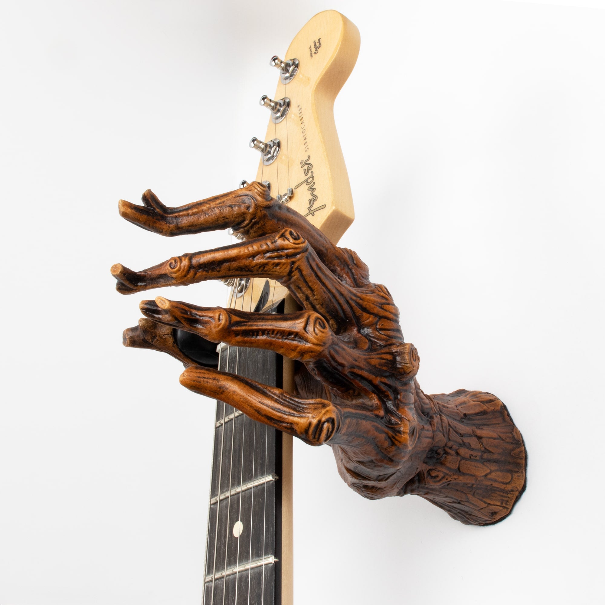 Tree branch guitar hanger wall hook mount holding stratocaster guitar. 