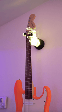 LED guitar hanger from GuitarGrip. Hand your guitar on the wall with lights. 