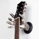 Silver hand shaped guitar hanger wall mounts from GuitarGrip.