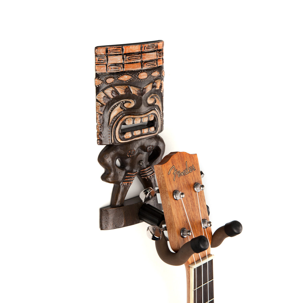 Fender ukulele hanging from GuitarGrip tiki hanger. 
